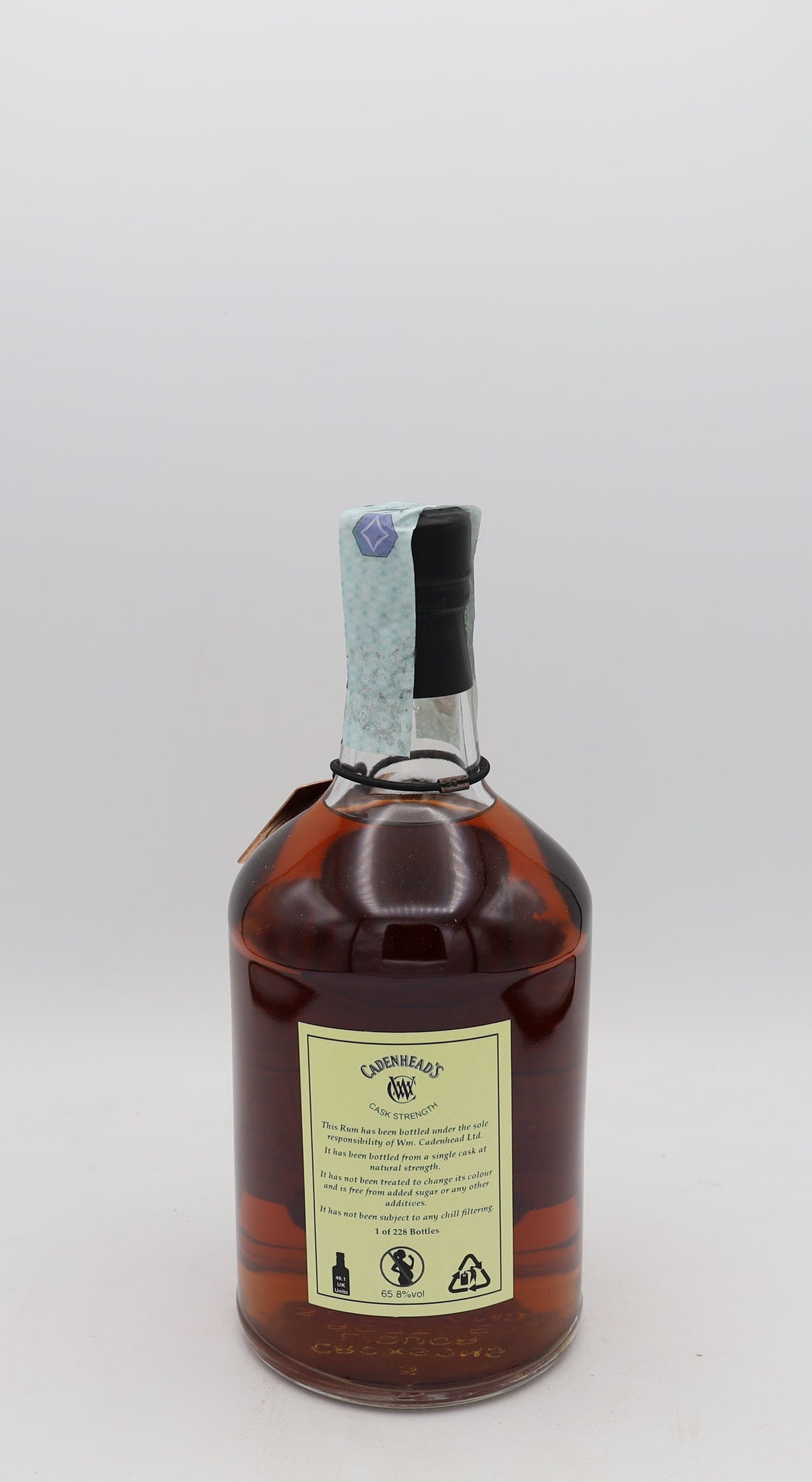 A Caroni Cadenhead’s 18-Year-Old Cask Strength Rum 1998, presented in a collector’s box – rare aged Caribbean rum with rich, intense flavors.