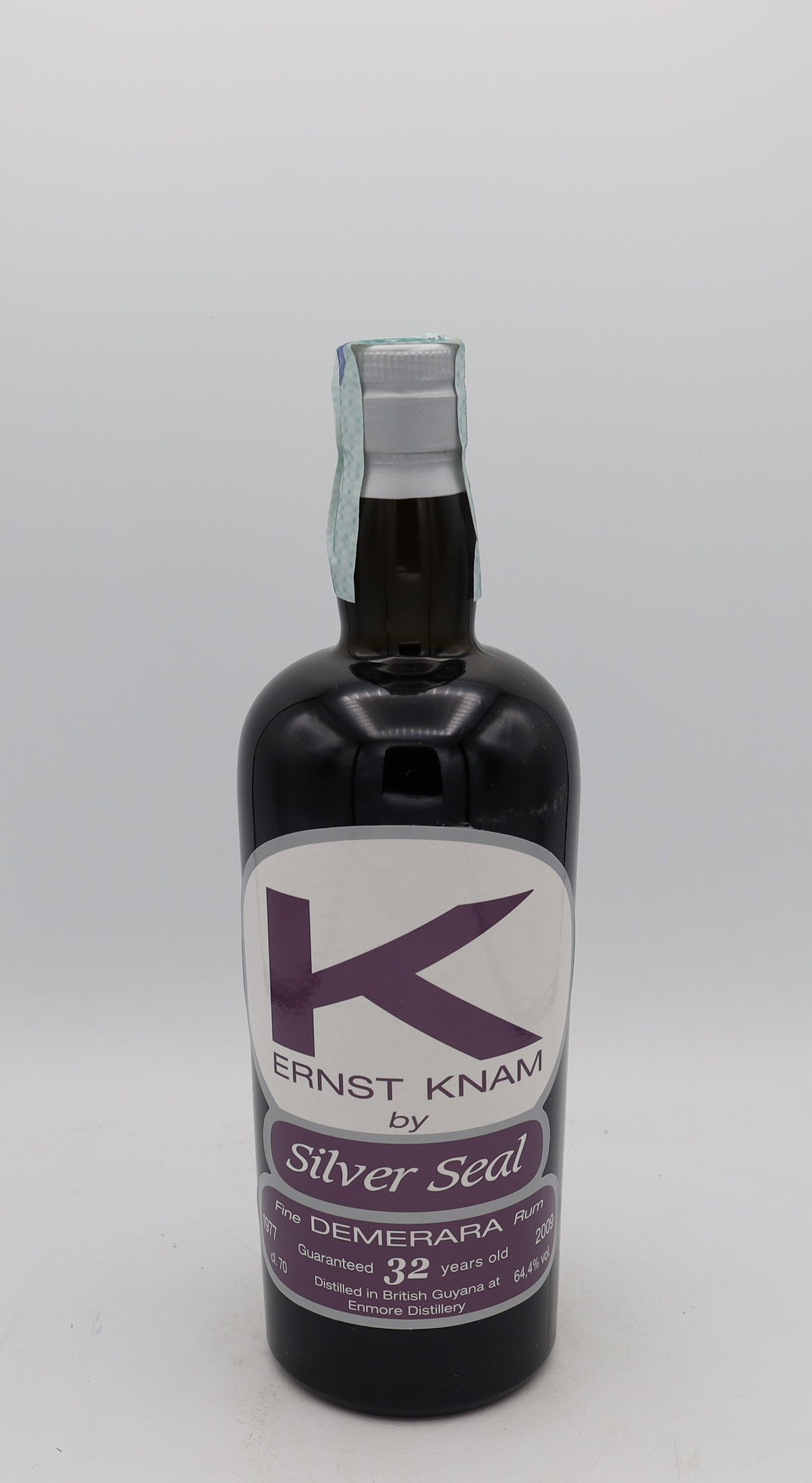 An Enmore 1977 Demerara Rum Ernst Knam Silver Seal, bottle 213, presented in a collector’s box – rare aged Caribbean rum with rich, complex flavors.