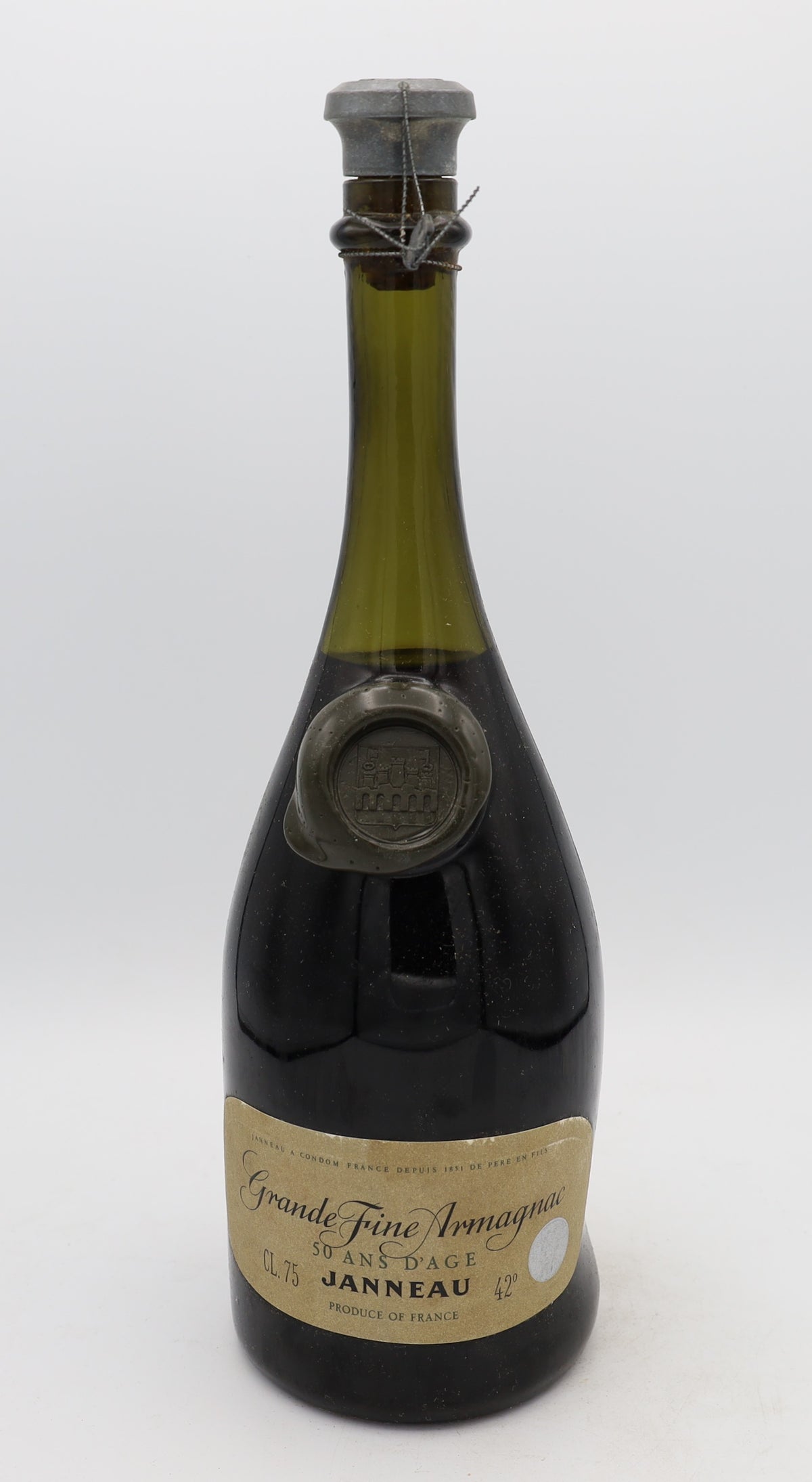 Janneau 50-Year-Old Grande Armagnac – exceptionally rare aged brandy with rich, complex flavors, presented for collectors.