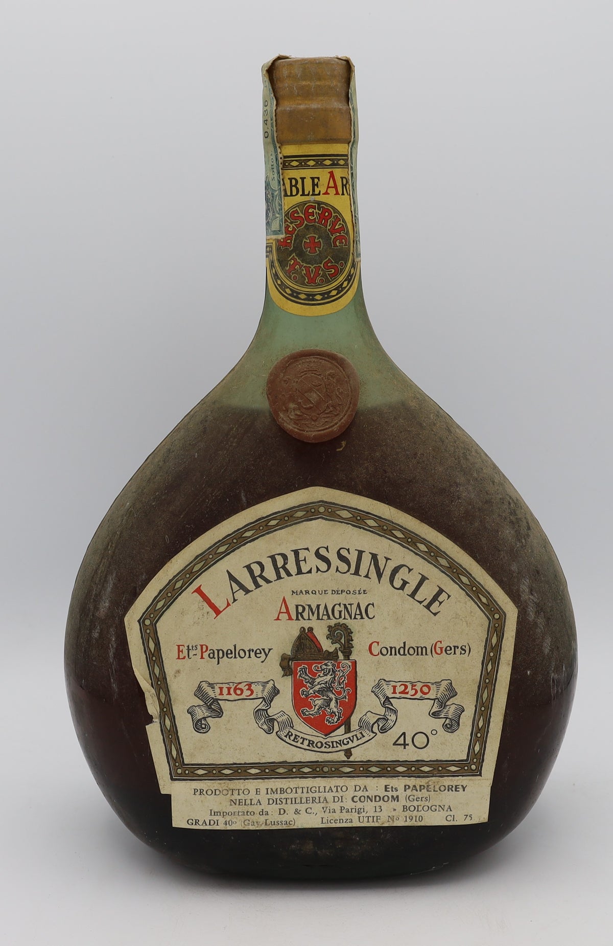 Larressingle Armagnac in red wax dumpy bottle – premium aged brandy with rich, complex flavors, presented in a distinctive collector’s bottle.