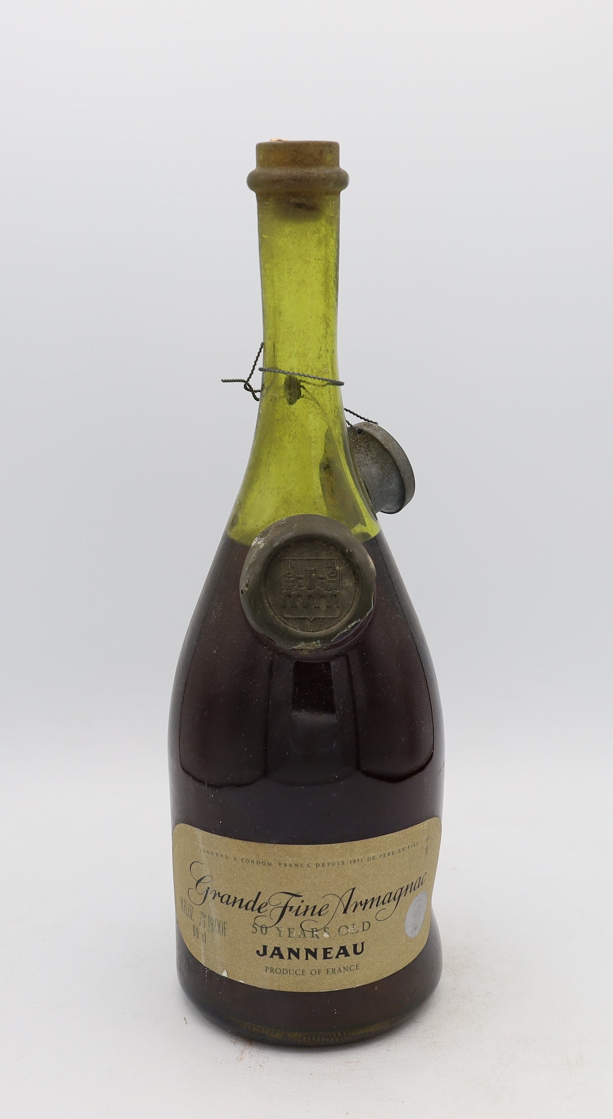 Janneau 50-Year-Old Grande Armagnac – exceptionally rare aged brandy with rich, complex flavors, presented for collectors.
